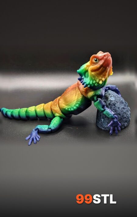 Bearded Dragon STL articulated 3D print in silk rainbow filament on a rock