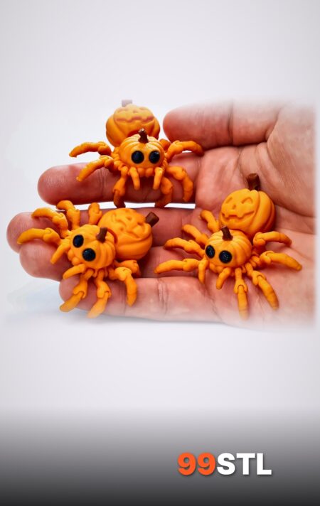 Three articulated pumpkin spider STL prints in orange held in a hand